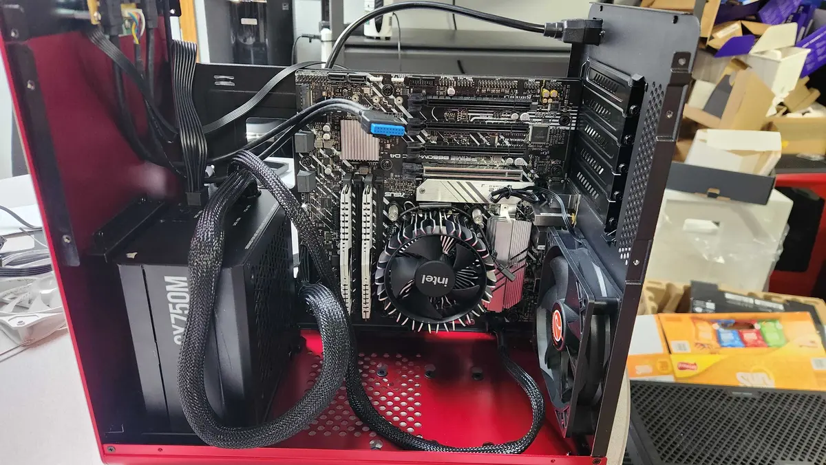 Desktop computer opened on a workbench for internal hardware inspection and repair